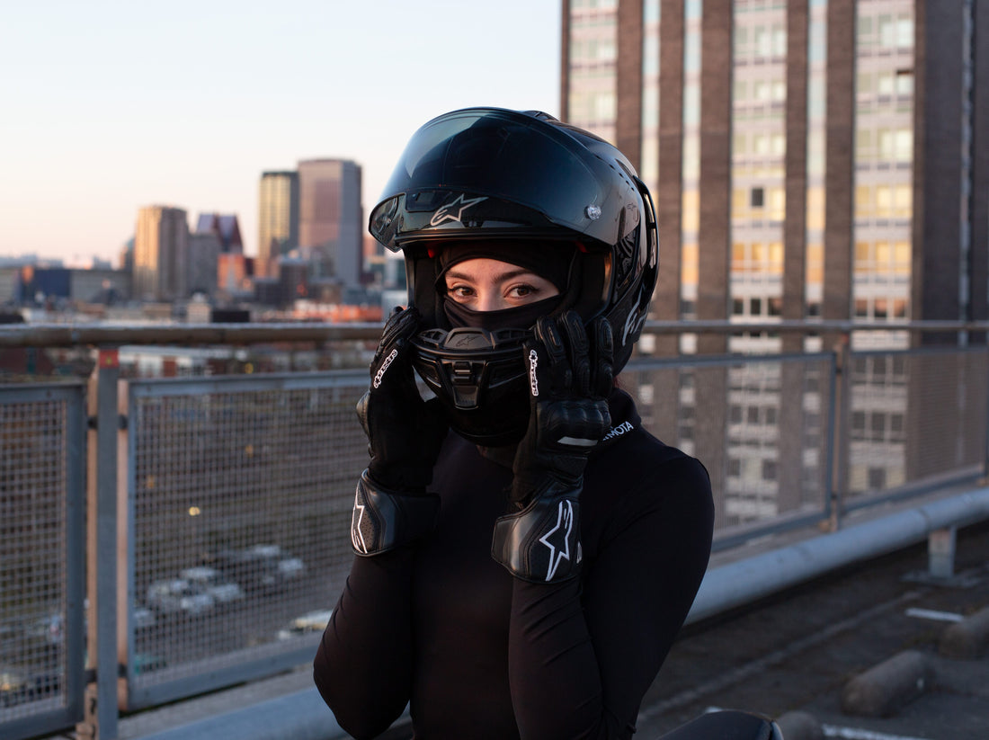 Female rider wearing a balaclava under a motorcycle helmet