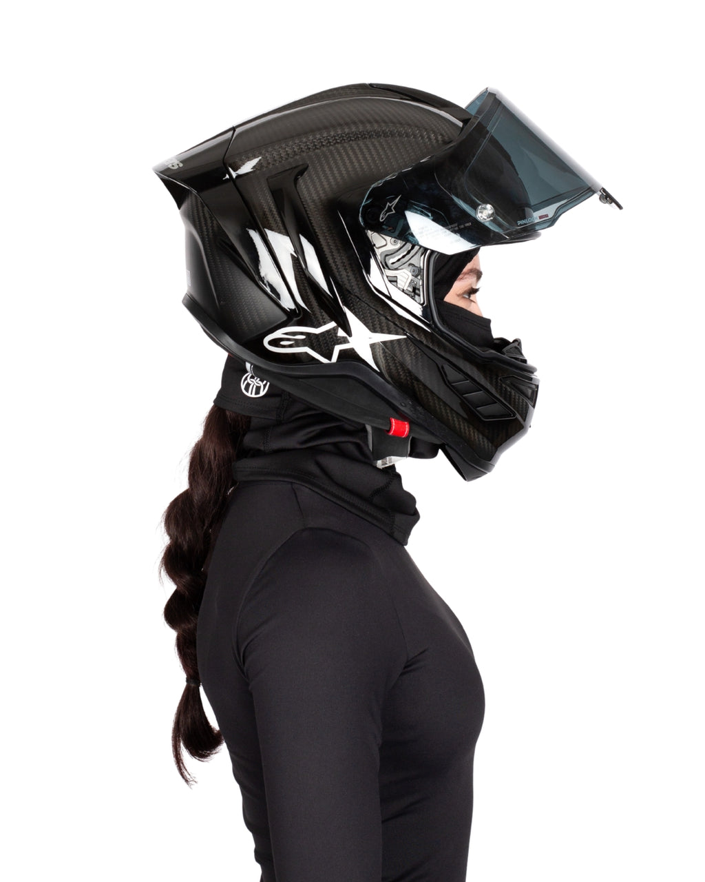 Side view of female rider wearing BRAIDFIT BALACLAVA and motorcycle helmet